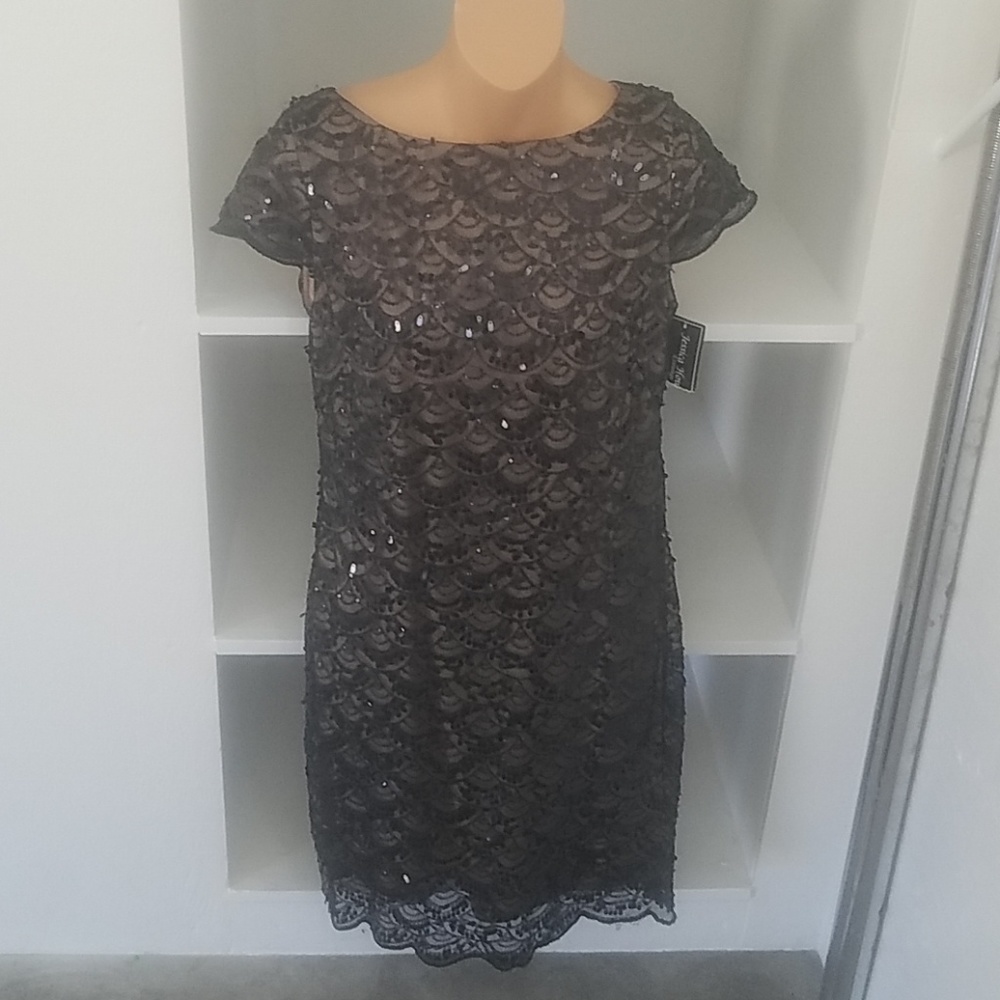 Stunning black and champagne sequence dress!